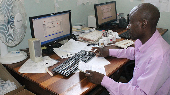 [Senior Pharmacist Assistant George Lukonga dispenses ARVs using the EDT at Katima Mulilo Hospital] {Photo Credit: SIAPS Namibia}