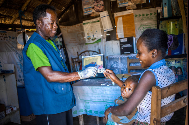 [Treating children like this two-year-old, who tested positive for malaria, is one of many reasons why CHVs serve a vital role in Malagasy communities.]