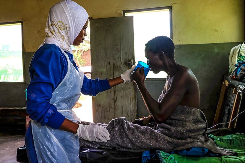 [A cholera patient recovers at a treatment center in Lilongwe District, Malawi.] {Photo Credit: Erik Schouten}