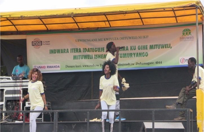 [The community based health insurance (CBHI) awareness campaign featured some of Rwanda’s biggest names in entertainment who traveled to all five provinces of the country. Photo Credit: MSH]