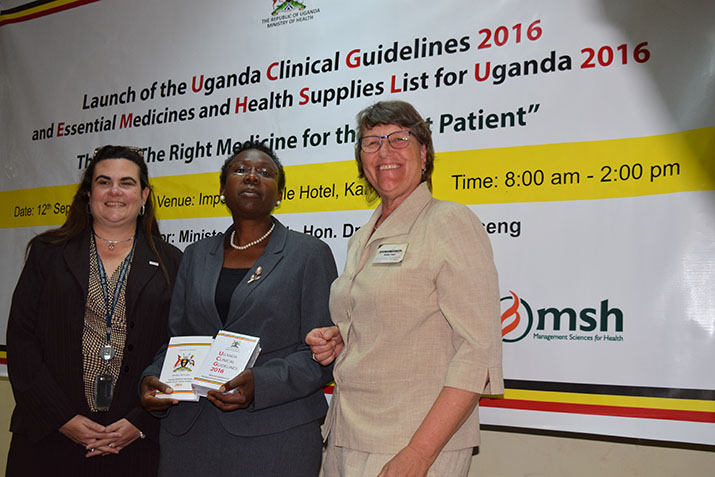 [Michelle Lang-Ali, Deputy Director of USAID's Health and HIV/AIDS office; Dr. Jane Ruth Aceng, Minister of Health, Uganda; and Birna Trap, Chief of Party, USAID/Uganda Health Supply Chain program, at the launch of the Uganda Clinical Guidelines 2016.]{Photo credit: Sheila Mwebaze}