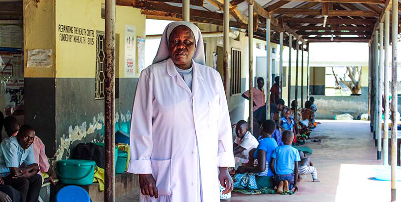 {Nurse Gabriella Oroma welcomes patients at Ngetta Health Centre in Uganda, where drug-resistant TB is treated. Photo credit: Sarah Lagot/MSH}
