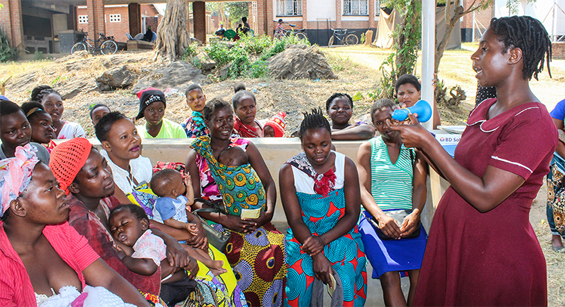 {Community midwives help facilitate group health talks on different family planning methods with clients. Photo credit: Rejoice Phiri/MSH}