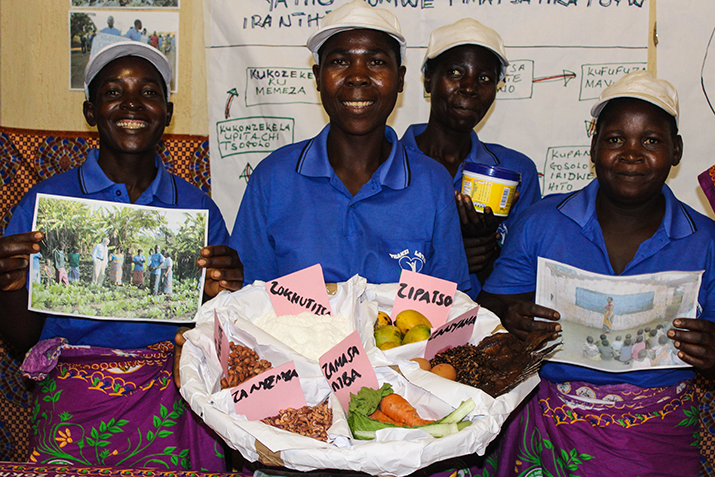{Members of the Chiwandira Champion Community showcase some of their activities, including promoting backyard gardens to curb malnutrition among children. Photo credit: Rejoice Phiri/MSH}
