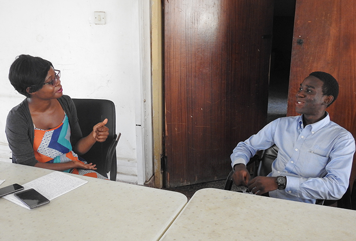 [Omena Eghaghara, Supply Chain Management Specialist for the CaTSS project, visits with Mayowa. Photo credit: Aor Ikyaabo/MSH]