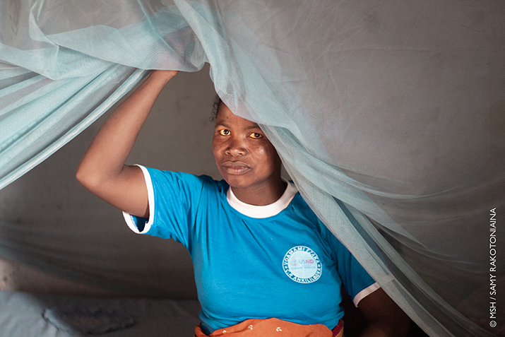 {A pregnant woman from southern Madagascar sits under a bednet. Photo credit: Samy Rakotoniaina/MSH}