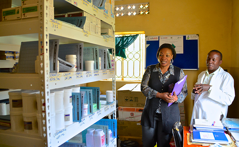 {A medicines management supervisor visits pharmacy staff in Uganda. Photo credit: MSH staff}