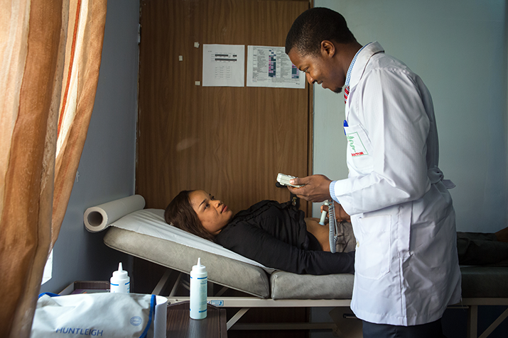 [A gynecologist consults a patient at the NISA Premier Hospital in Abuja, Nigeria. Photo Credit: Gwenn Dubourthournieu]
