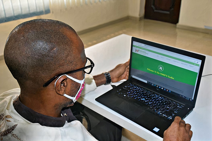[The NMEP electronic toolkit in use by a health care worker in Cross River State, Nigeria. Photo credit: Oluwatobiloba Akerele/MSH]