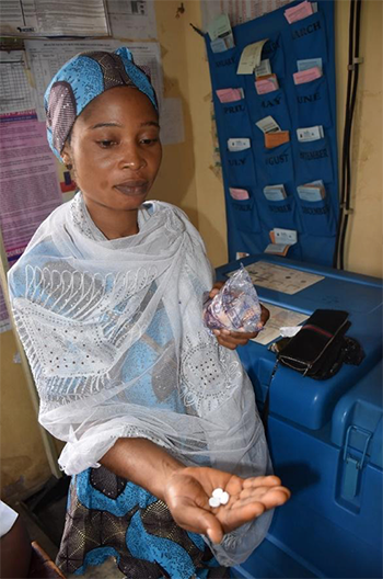 [A pregnant woman takes her second dose of IPTp at Koseunti Primary Health Care Center in Oyo State, Nigeria. Photo credit: Oluwatobiloba Akerele/MSH]