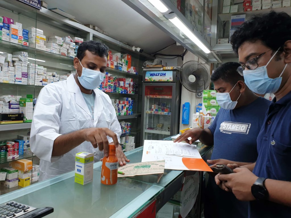 A client picks-up a prescription-at-a private sector drug shop