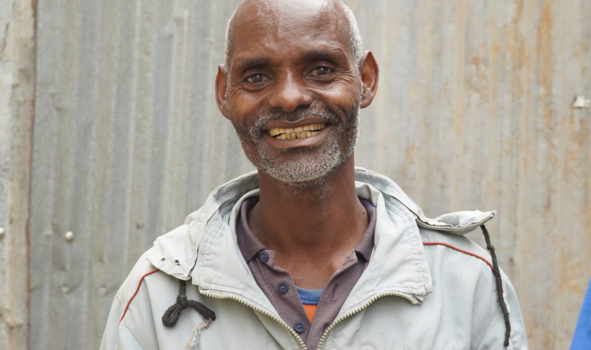 Getu-smiling-outside-in-the-courtyard-at-Yirgalem-General-Hospitals-TB-Treatment-Initiation-Center_2-scaled alt