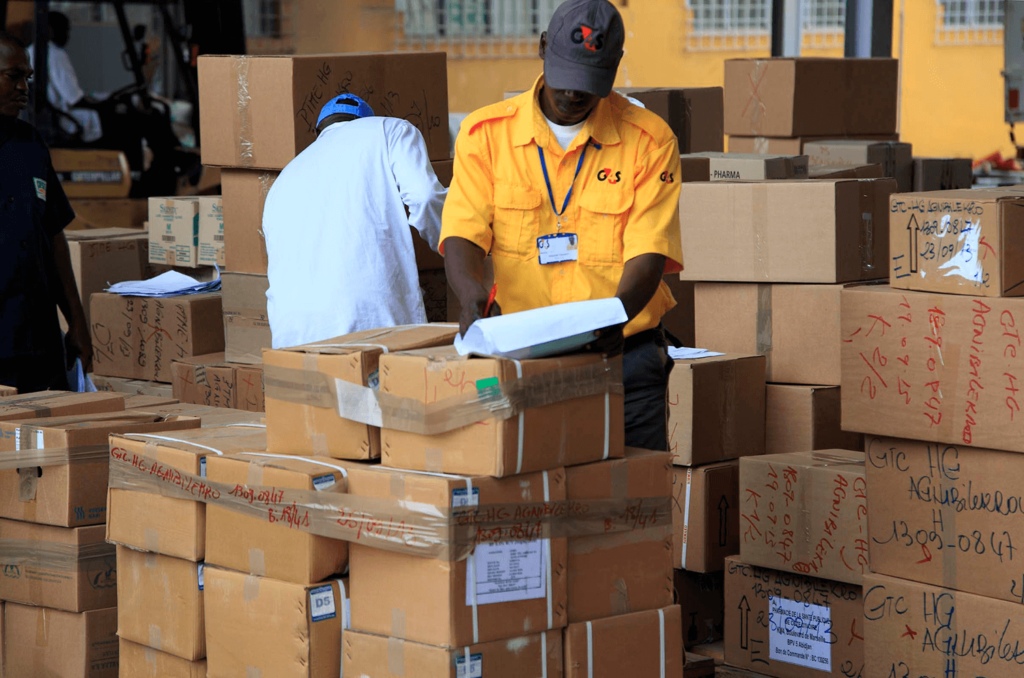 Workers manage medicine stock in Cote D'Ivoire
