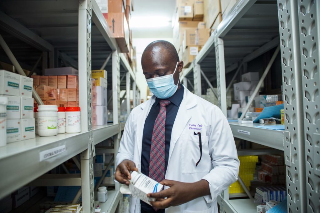 A pharmacist in a medicines stock room