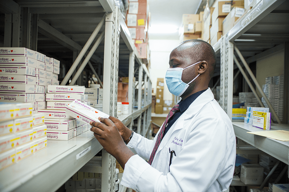 Pharmacist Falisy Lule in the medicines-stock-room-at-Kiruddu-National-Referral Hospital in Uganda
