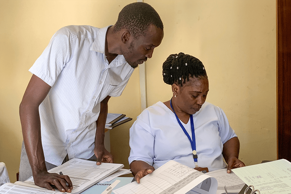Nurses review patient records in Tanzania