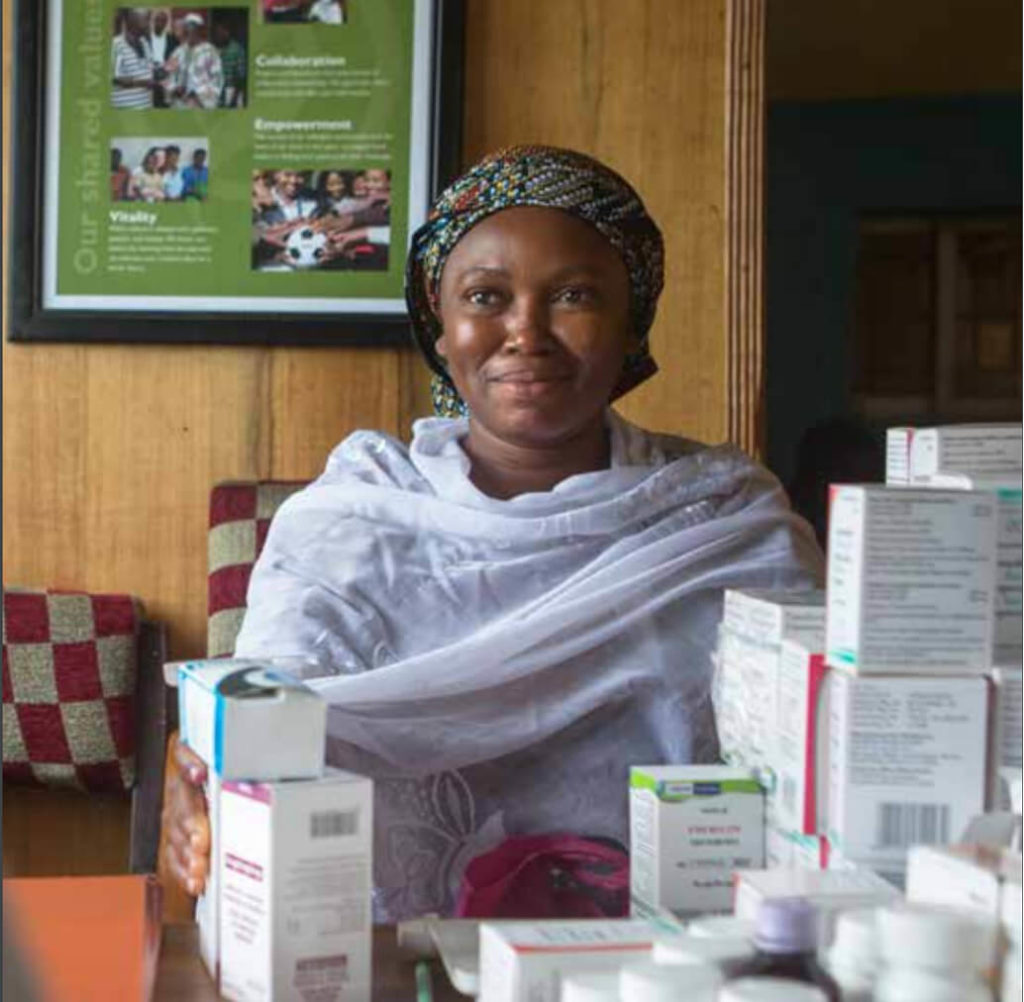Woman receiving medicines.