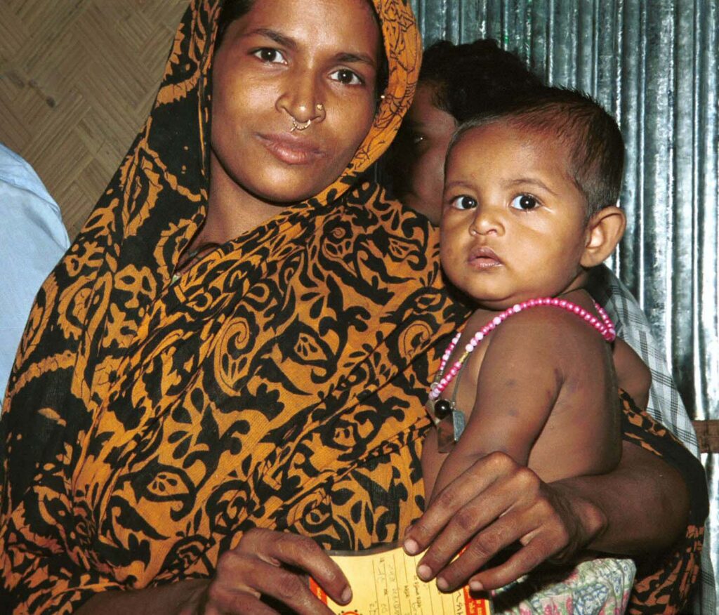 A Bangladeshi mother holds her infant child.