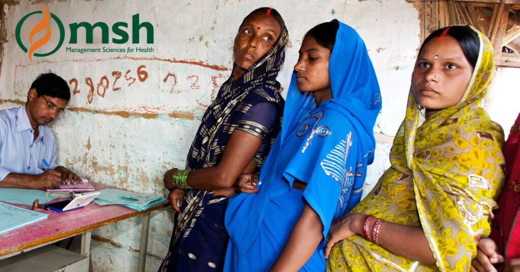 Social media card for the Meta campaign in Bangladesh with an image of three pregnant women holding their bellies and standing in line in front of a desk where a healthcare worker is sitting filling out paperwork.