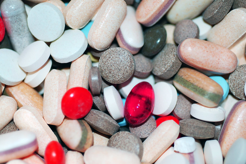 Stock image of medicine tablets and capsules.