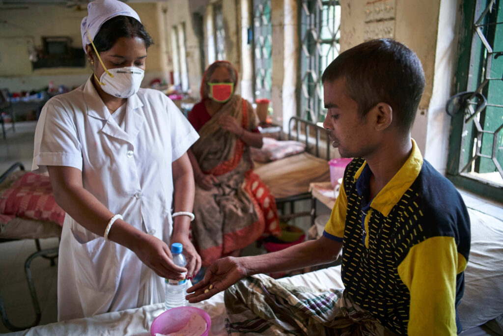 A nurse administers TB treatment under CTB in Bangladesh. Photo Credit: Shehzad Noorani