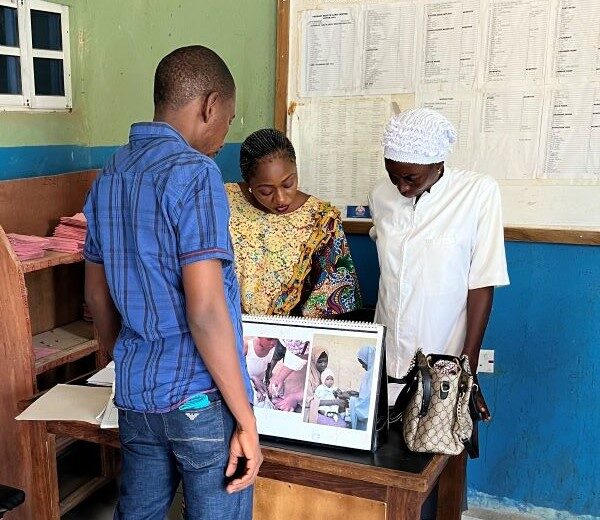 A man receives training in malaria case documentation from two health workers. Global Fund Malaria Project - Nigeria. Photo credit: MSH