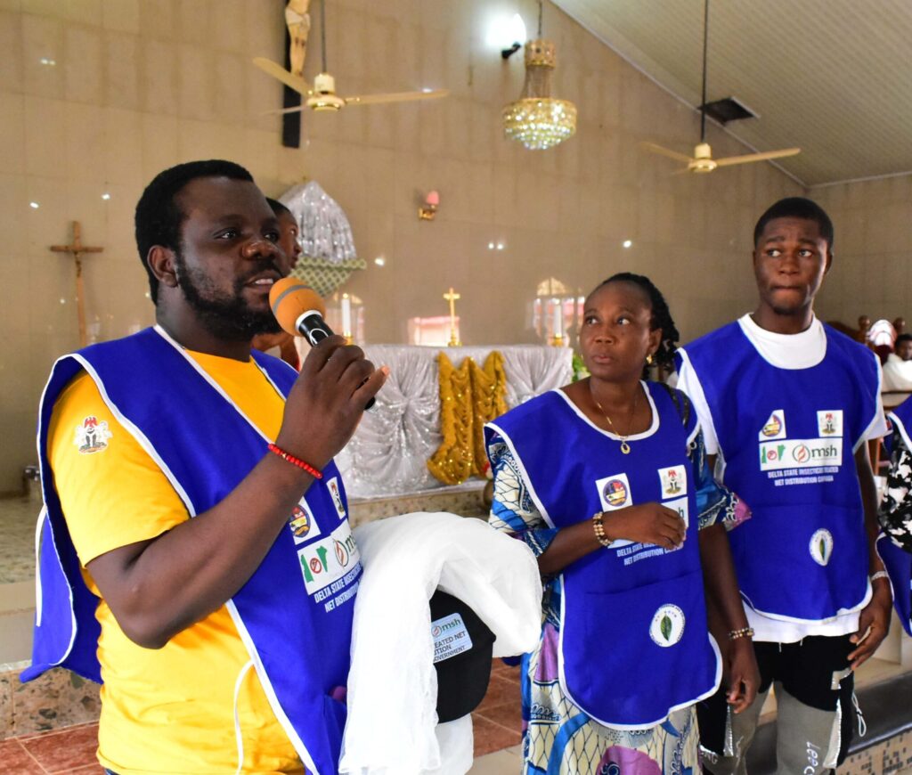 Nigerian health workers prepare to distribute insecticide treated bed nets in rural communities.