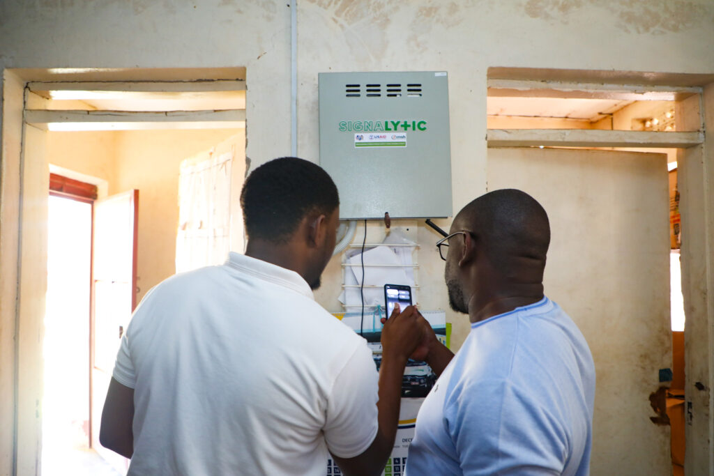 Team members install and troubleshoot the S+ system at Ariwa Health Center III. Photo credit: USAID SSCS - Uganda