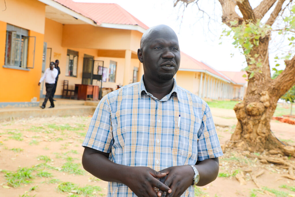 Thanks to support from Signalytic and USAID SSCS, George Madrara can check medical stock levels in an instant using a solar-powered tablet. Photo credit: USAID SSCS - Uganda