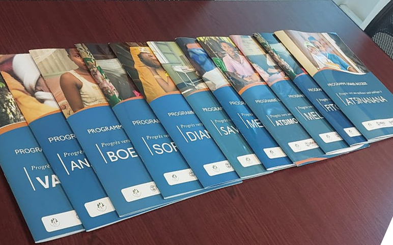 ACCESS regional booklets laid out on a table - Madagascar