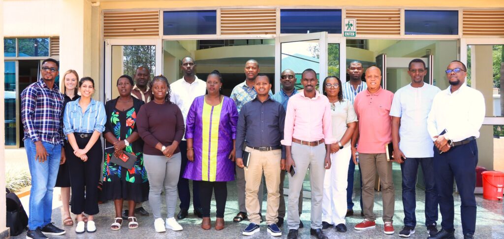 Group picture of workshop participants in front of building.