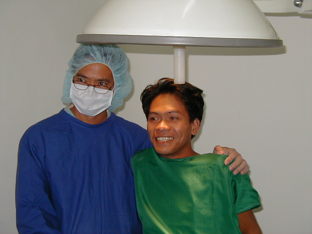 A doctor and his assistant in a doctor's office