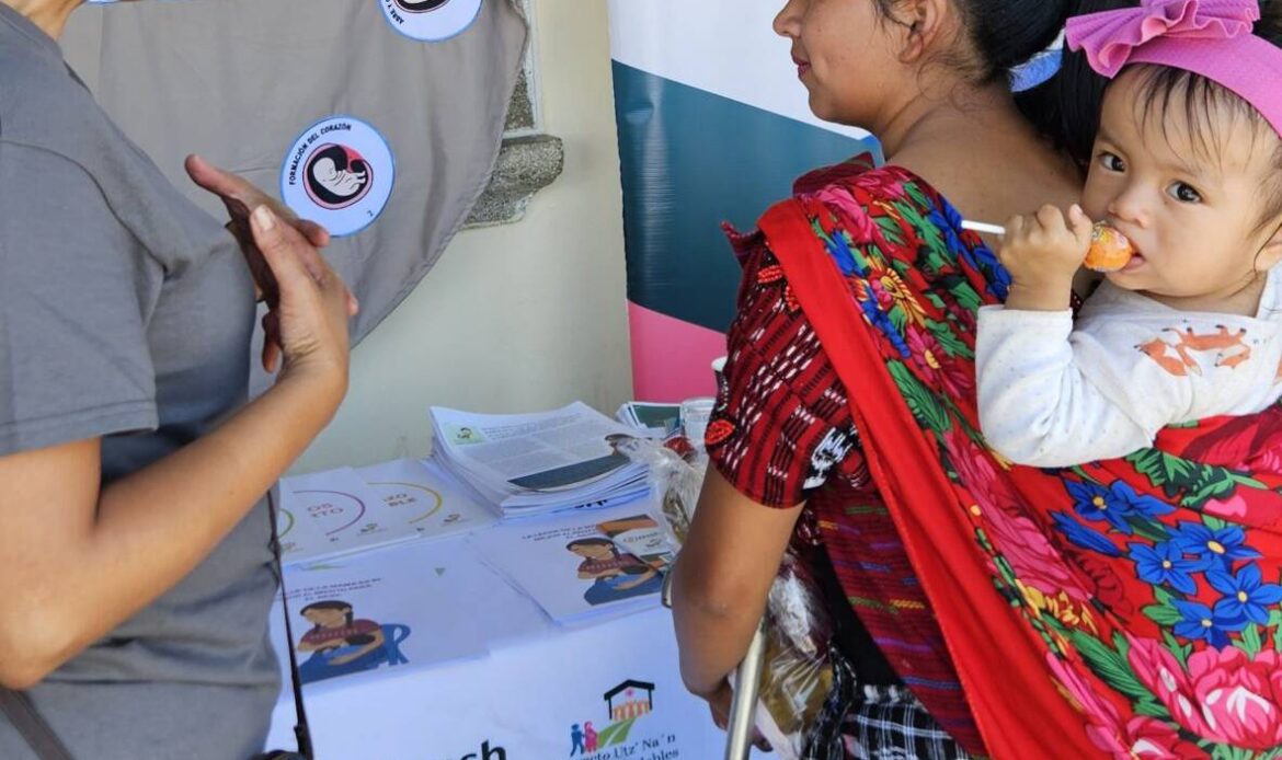Two women at a maternal health event. One woman