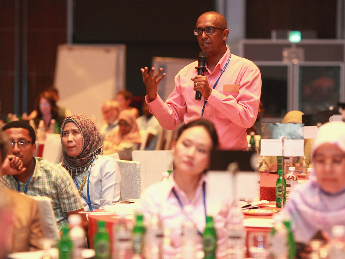 Man asks a question at a conference.