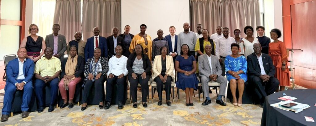 Group photo of district health leaders, local leaders, and health partners at an event in Kigali Rwanda
