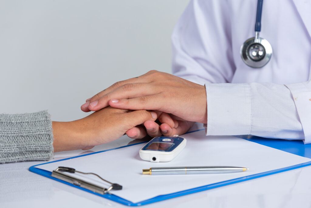 World diabetes day, doctor holding patients hand