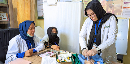 Three health workers receiving training for umbilical cord care. Three health workers receiving training for umbilical cord care.