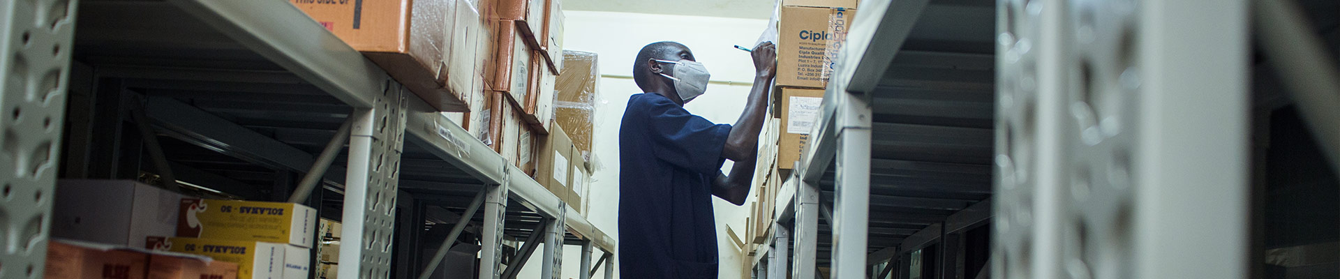 An inventory officer working in a storage room.